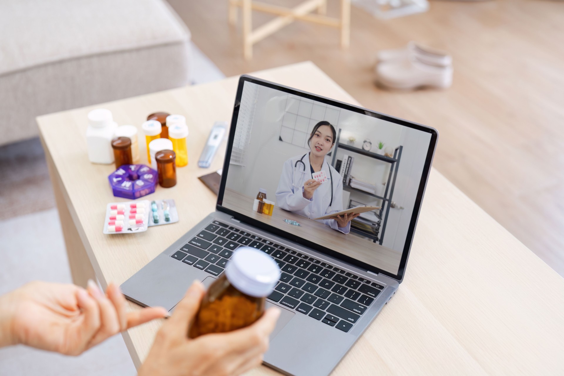 Online Medical Consultation with Doctor via Video Call on Laptop in Modern Home Setting